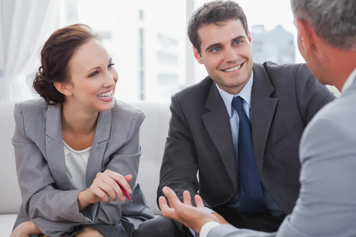 Movaci consultants in conversation with a client about their technology needs